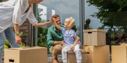 Unveiling Variable Rates in Portugal: An In-depth EU Comparison 35 A joyful Portuguese family moving into their new home financed by a loan with variable rates in Portugal.