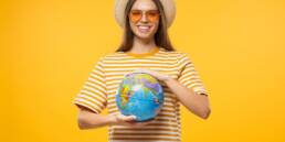 American Visa for Portugal: Your Comprehensive Guide 13 Girl holding a globe planning for American Visa for Portugal
