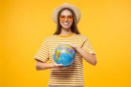 American Visa for Portugal: Your Comprehensive Guide 8 Girl holding a globe planning for American Visa for Portugal