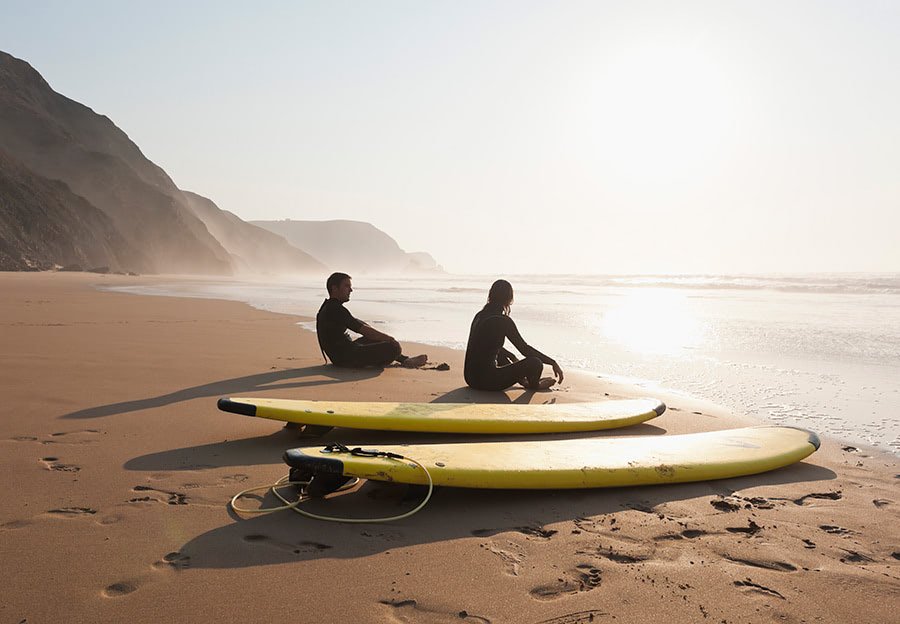 What exciting outdoor activities does Portugal offer? 1 Surfer skillfully riding a wave in Portugal, perfectly illustrating the thrilling outdoor activities the country offers