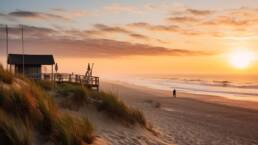Costa da Caparica in Top Coolest Neighborhoods of 2023 1 Sunset at Costa da Caparica in Top beaches with a beach shack on the left